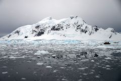 10A Zodiacs Are Dwarfed by The Mountains On Bryde Island In Paradise Harbour On Quark Expeditions Antarctica Cruise